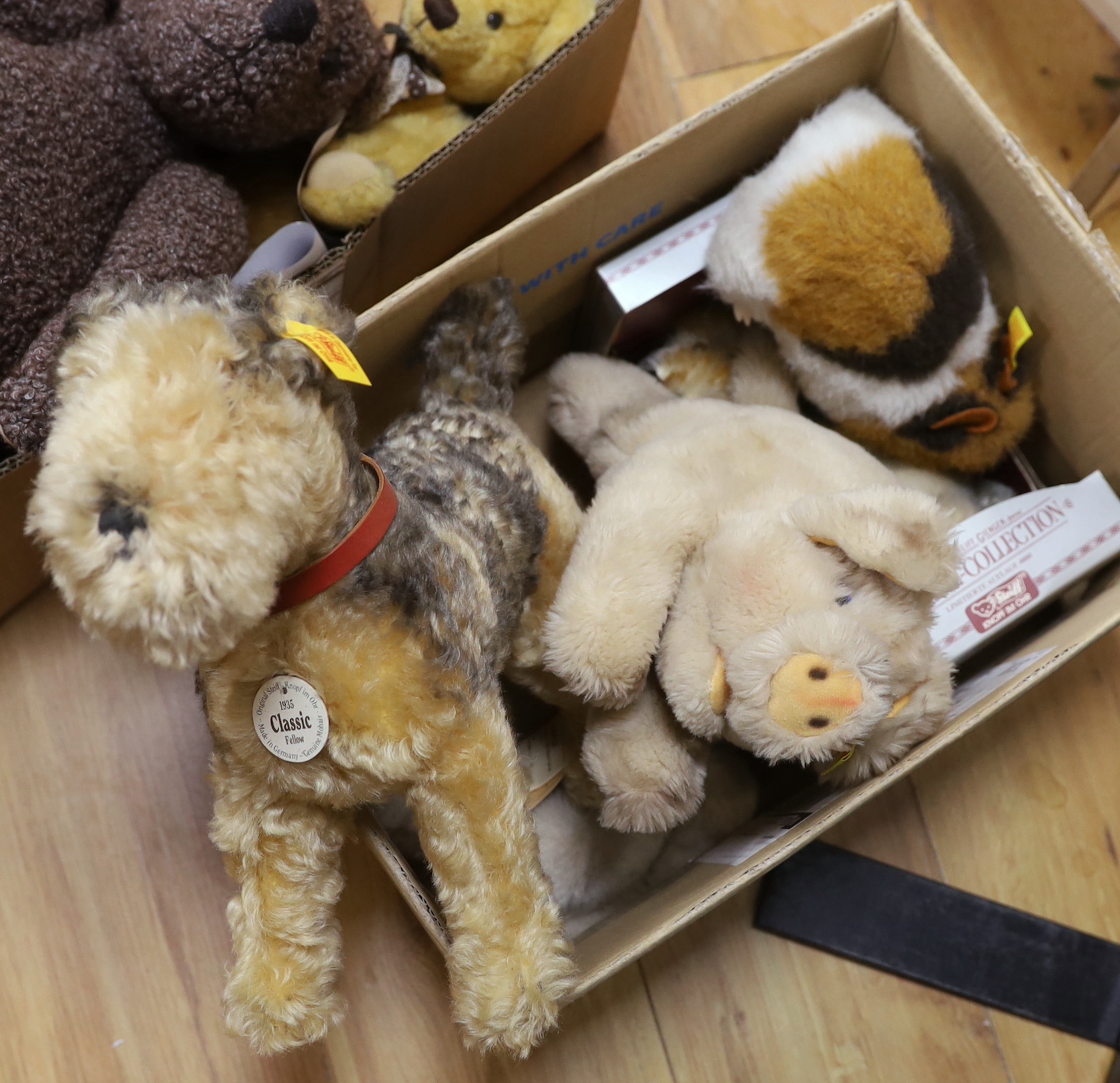 A Classic 'Fellow' Terrier label / tag with five assorted yellow tag animals, also boxed Museum Collection 'Rattler' Terrier white label with neck mechanism and a black Merrythought teddy